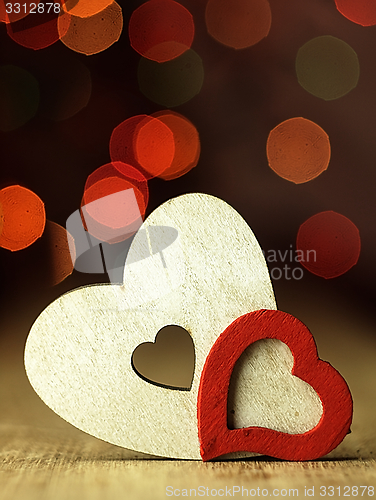 Image of Heart\'s on a wooden boards background.