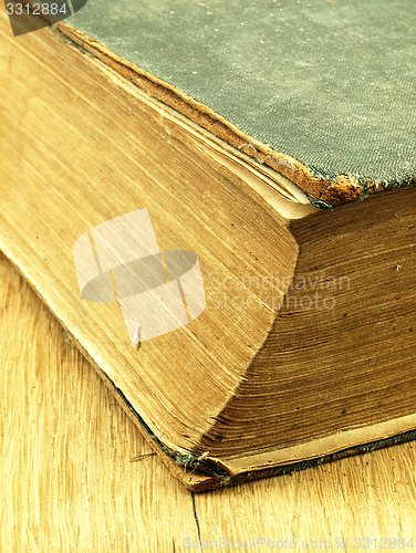 Image of Old closed the book with a damaged cover.