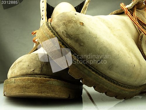 Image of Pair of old, worn heavy boots.