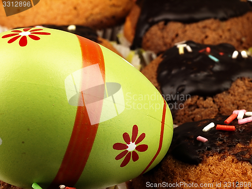 Image of Easter egg andMuffins with chocolate icing.