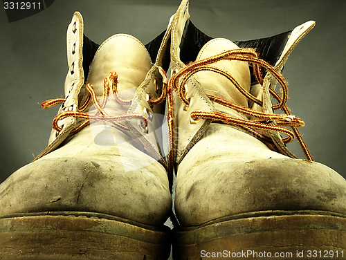 Image of Pair of old, worn heavy boots.