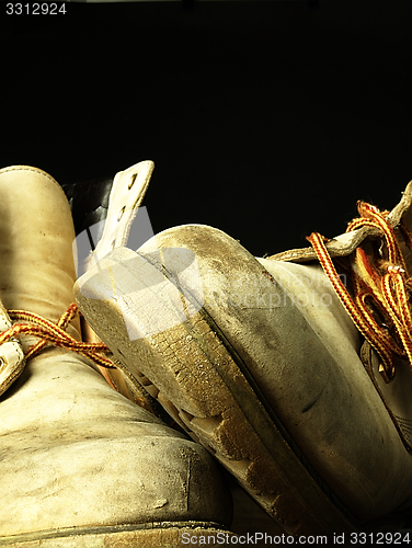 Image of Pair of old, worn heavy boots.