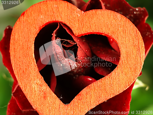 Image of Heart and rose with dew drops on the petals.