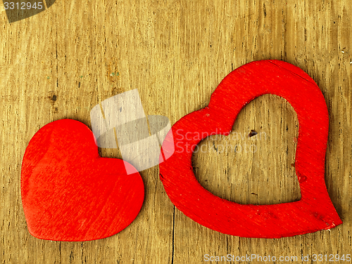 Image of Wooden heart on the oak table.