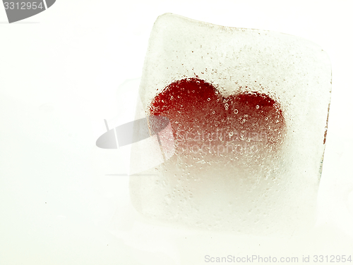 Image of Red heart embedded in ice.