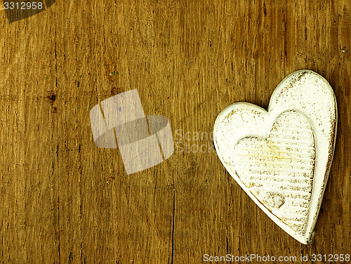 Image of Wooden heart on the oak table.