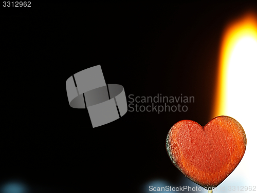 Image of Flaming heart on a black background.