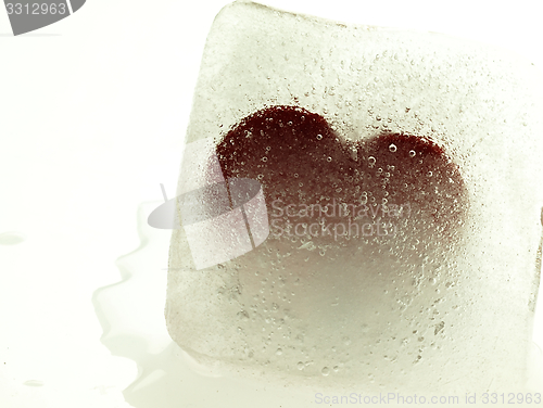 Image of Red heart embedded in ice.