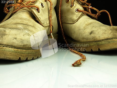 Image of Pair of old, worn heavy boots.