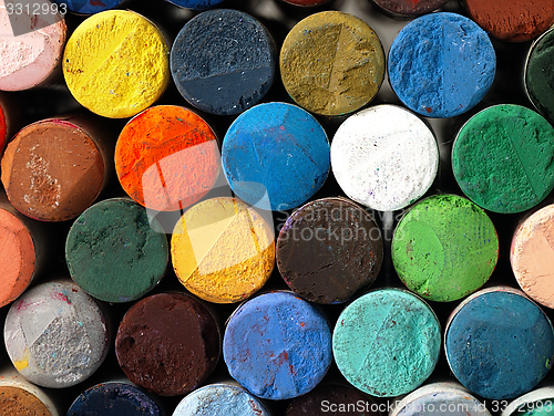 Image of Colored dry pastel crayons closely.