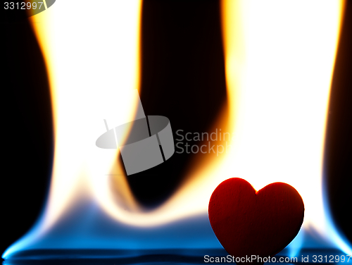 Image of Flaming heart on a black background.