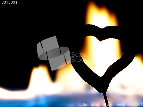 Image of Flaming heart on a black background.