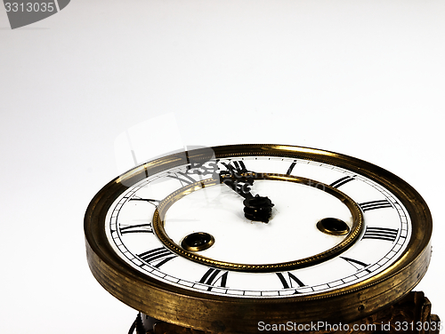 Image of Old clock with roman numerals.