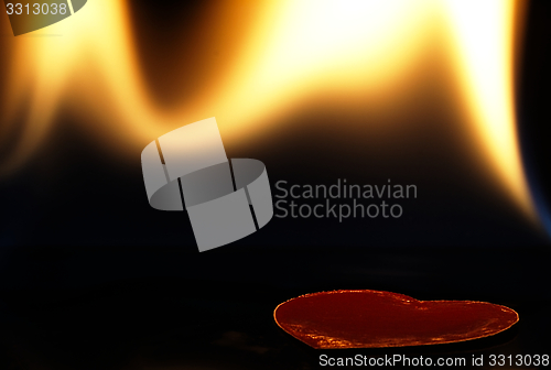 Image of Flaming heart on a black background.