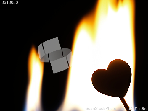 Image of Flaming heart on a black background.