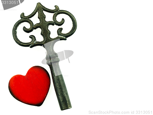 Image of Old metal key and red heart.