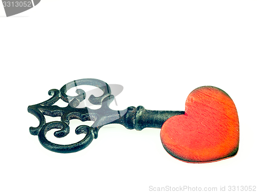 Image of Old metal key and red heart.