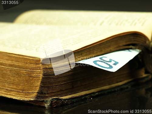 Image of Old book and paper money.