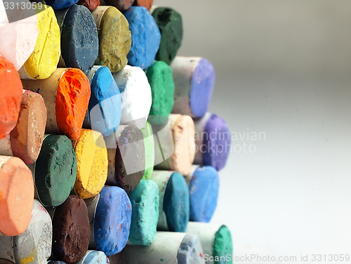 Image of Colored dry pastel crayons closely.