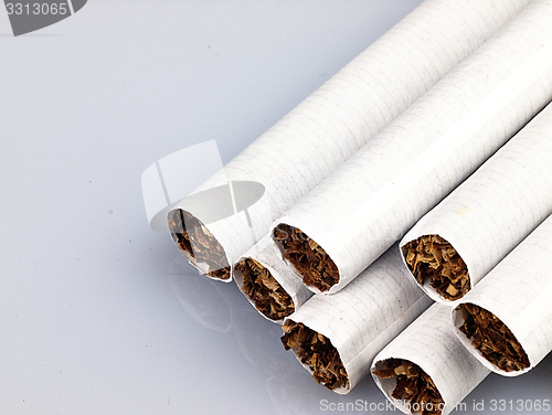 Image of Several cigarettes on a white background.