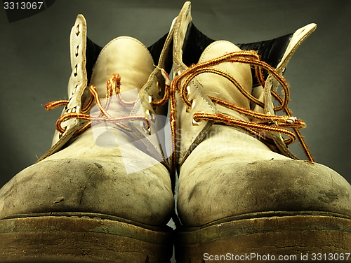 Image of Pair of old, worn heavy boots.