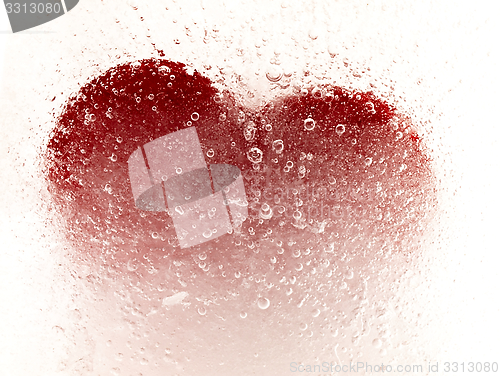 Image of Red heart embedded in ice.