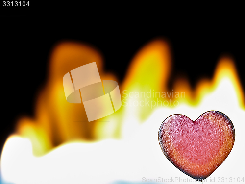 Image of Flaming heart on a black background.