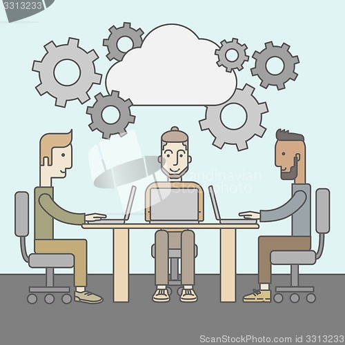 Image of Image of business partners discussing documents and ideas at meeting
