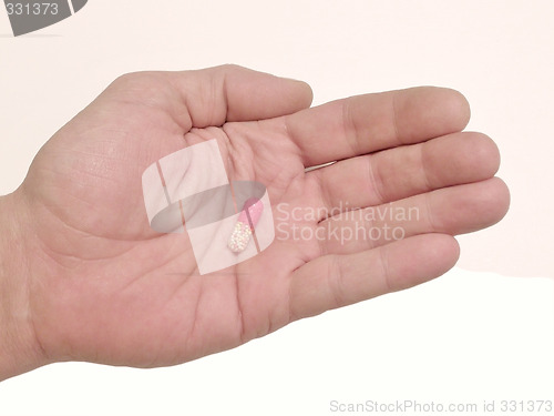 Image of pill in hand