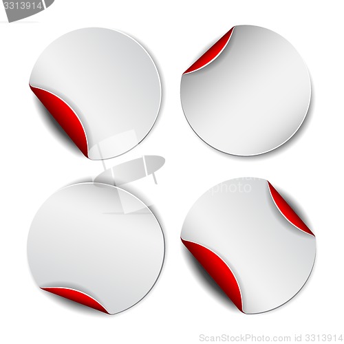 Image of Set of white round promotional stickers with red backside.  