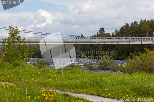Image of Suspension bridge over the river 