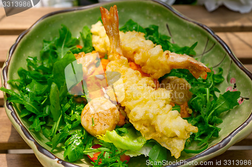 Image of fresh Japanese tempura shrimps with salad