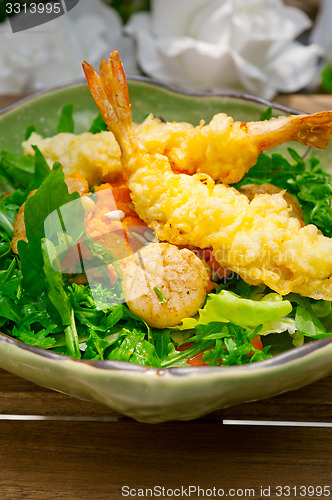 Image of fresh Japanese tempura shrimps with salad