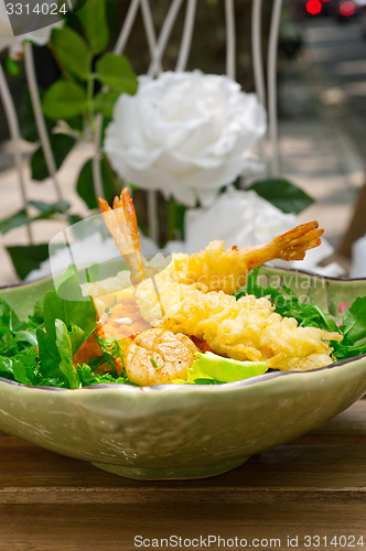 Image of fresh Japanese tempura shrimps with salad