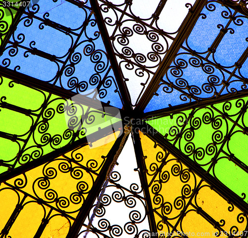 Image of colorated glass and sun in morocco africa window and light