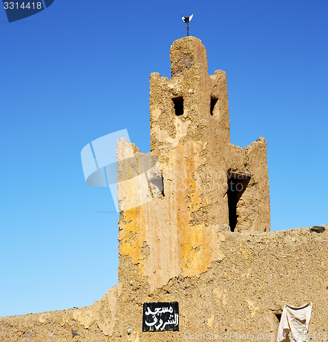 Image of old brown construction in africa   morocco and sky  near the tow