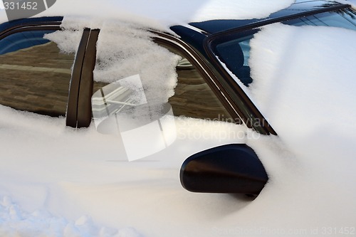 Image of Car covered by snow