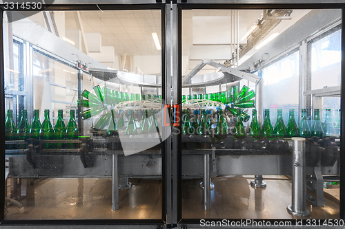 Image of Bottling machine with many bottles