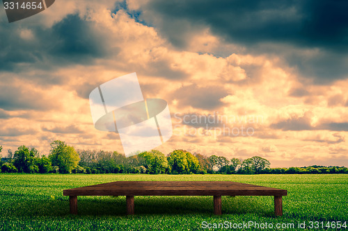 Image of Wooden stage on a field