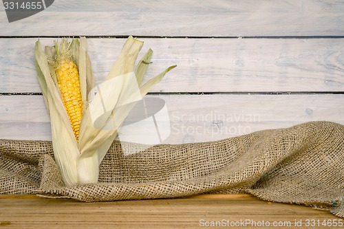 Image of Corn cob on a wooden table