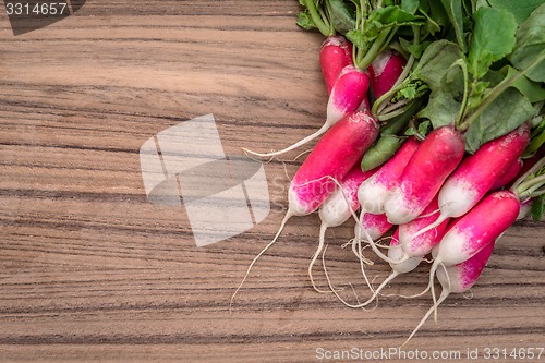 Image of Radishes on a wooden table