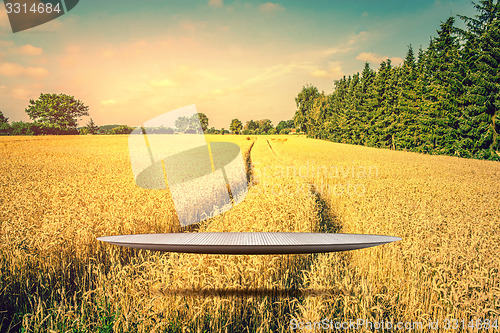 Image of Stage hovering over a golden field