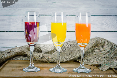 Image of Juice variations on a wooden table