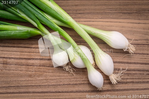 Image of Scallions on a wooden board