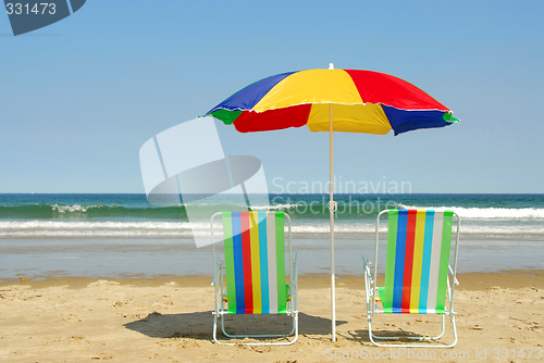 Image of Beach chairs and umbrella