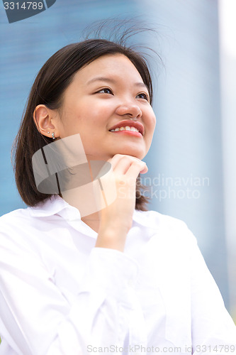 Image of Young Asian female executive smiling portrait