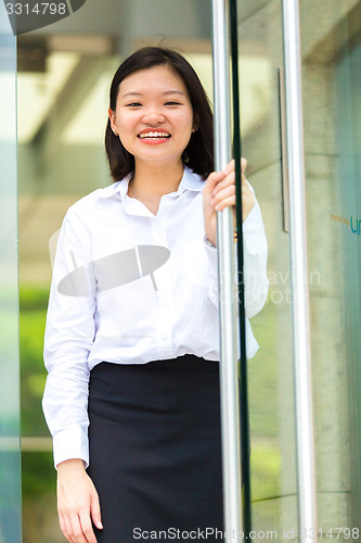 Image of Young Asian female executive smiling portrait