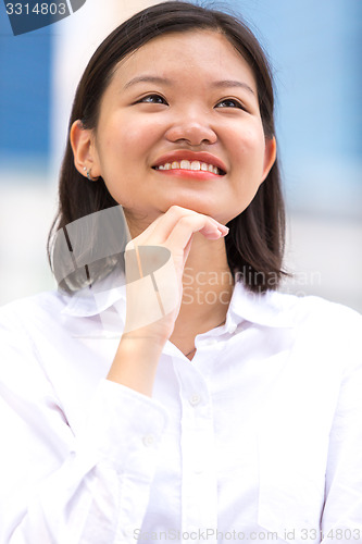 Image of Young Asian female executive smiling portrait