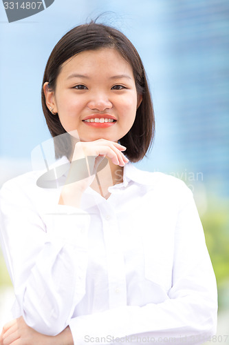 Image of Young Asian female executive smiling portrait