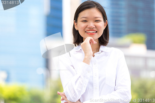 Image of Young Asian female executive smiling portrait